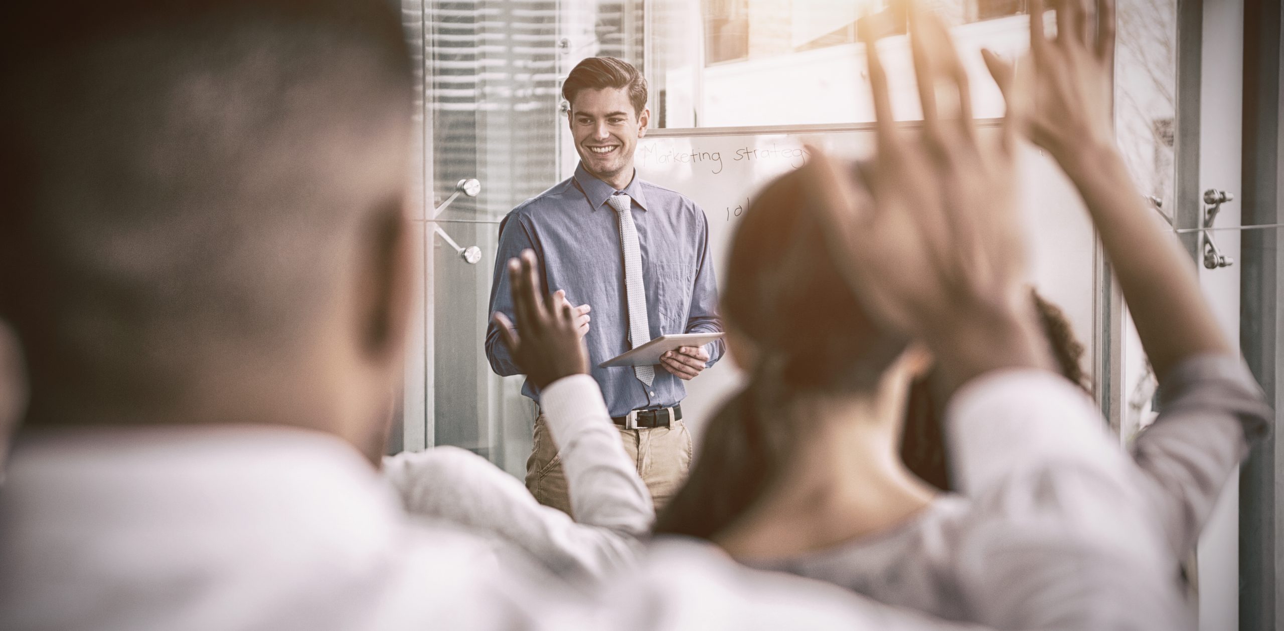 Businessman interacting with colleagues during meeting in office